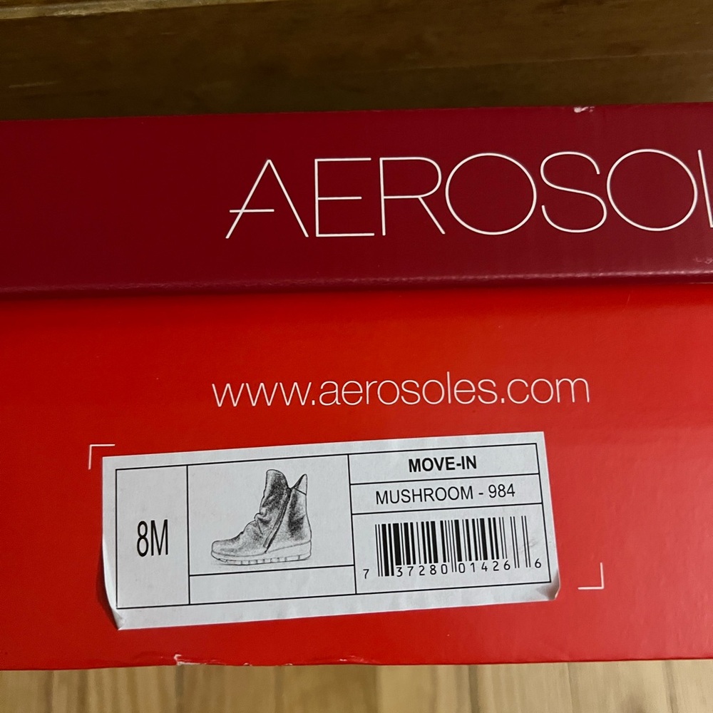 Women’s Aerosoles gathered leather wedge boots.